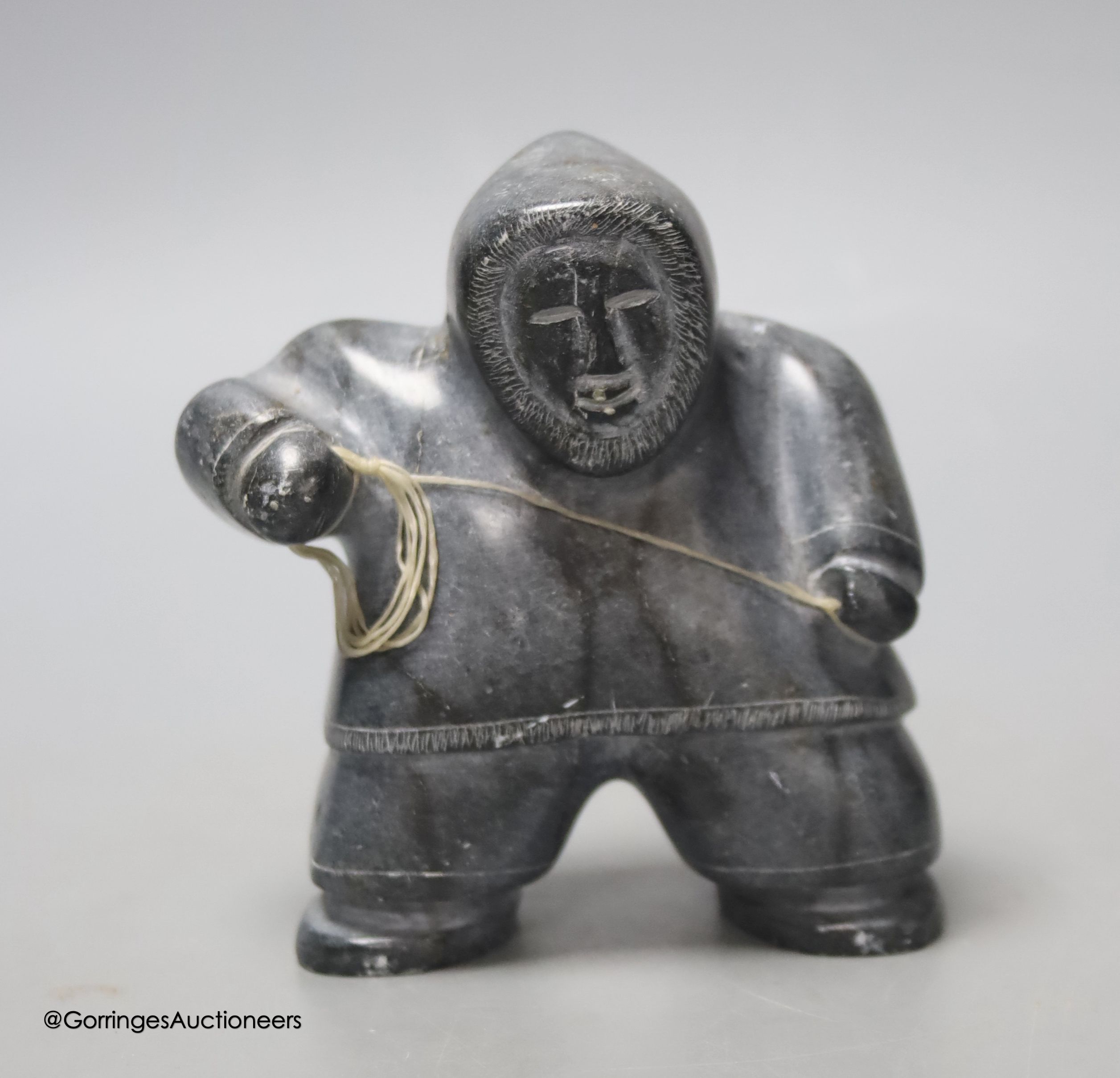 A carved stone inuit eskimo fisherman, height 11cm